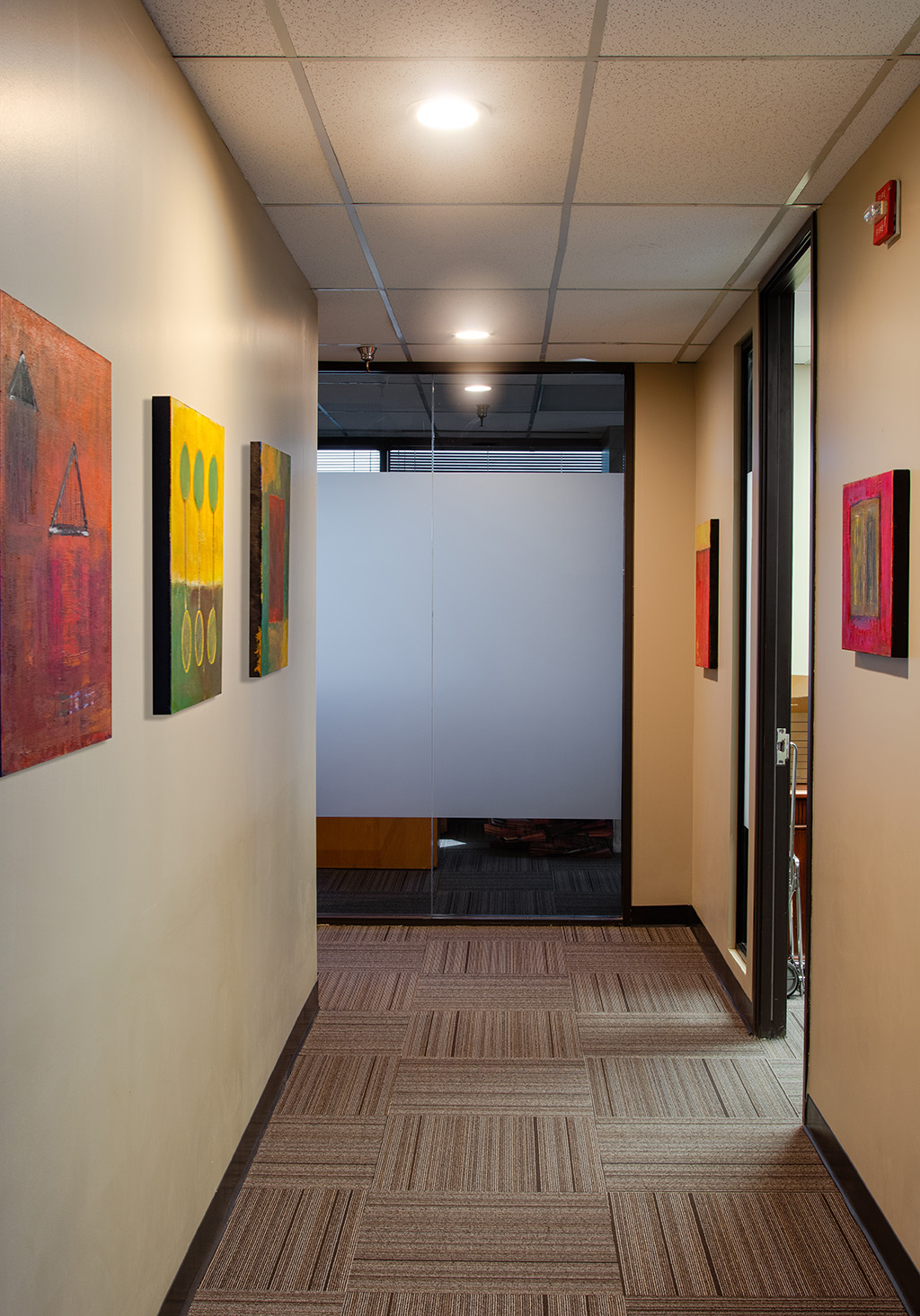 hallway with artwork at Jones, Davis & Jackson, PC office